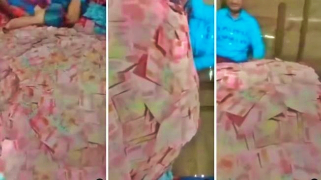 Tangkapan layar video seorang lelaki tua di depan tumpukan uang pecahan ratusan ribu