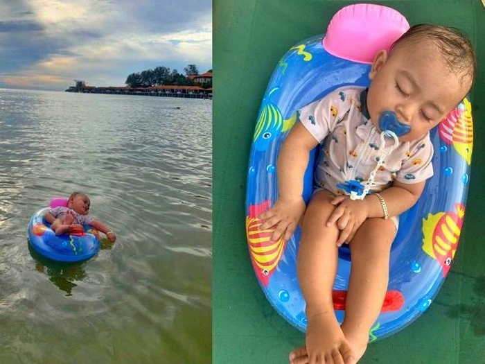 tangkapan layar video bayi tidur di atas pelampung di laut